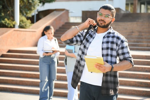 Happy indian male student at the university photo