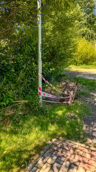 the pit was fenced off with red and white striped tape during the renovation photo