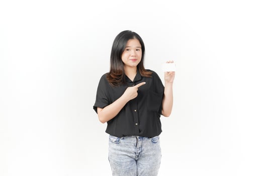 Young Asian woman presenting and showing blank card wearing Black t-shirt and jeans isolated on white background photo