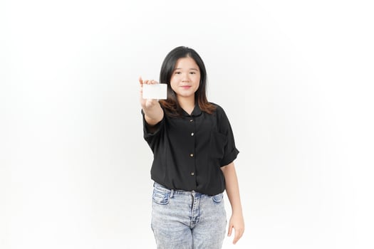 Young Asian woman presenting and showing blank card wearing Black t-shirt and jeans isolated on white background photo