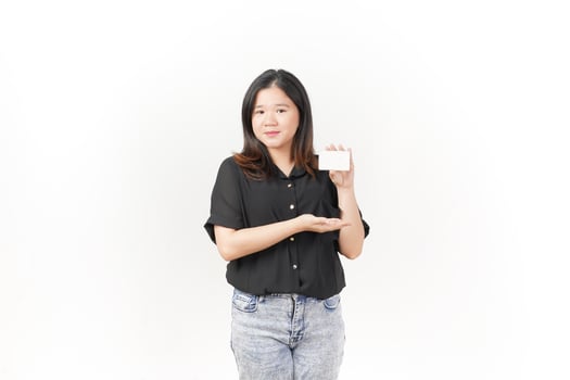 Young Asian woman presenting and showing blank card wearing Black t-shirt and jeans isolated on white background photo