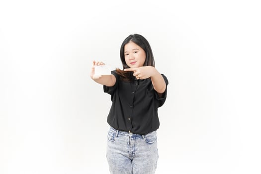 Young Asian woman presenting and showing blank card wearing Black t-shirt and jeans isolated on white background photo