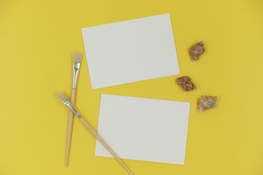 Blank paper mockup with brush and shells photo