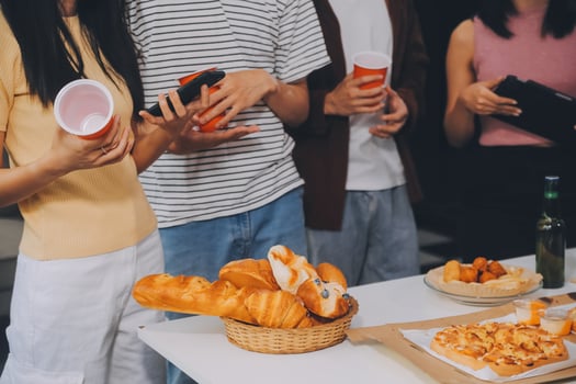 Group of young friends eating pizza.Home party. photo