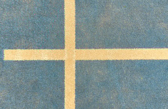 white line on a blue paddle tennis court. photo
