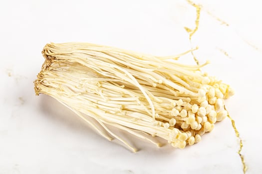 Tasty raw enoki mushroom heap photo