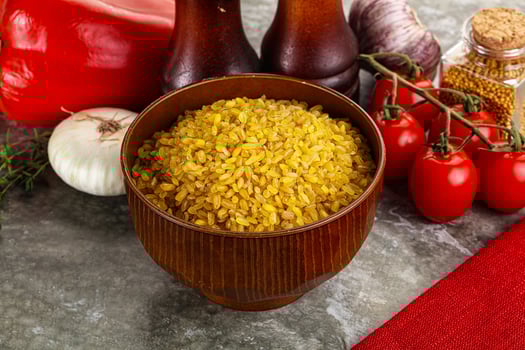 Dry wheat bulgur cereal heap photo