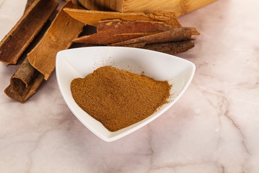 Natural Cinnamon powder with sticks photo