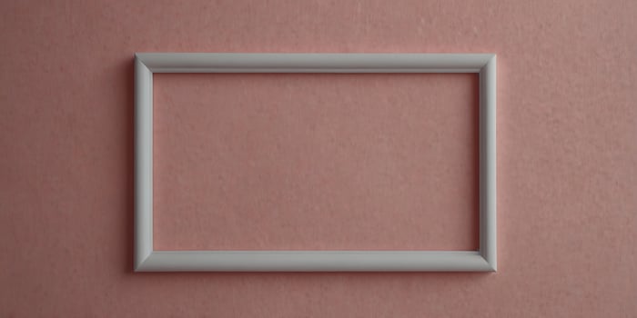 A white paper frame with a pink background. photo
