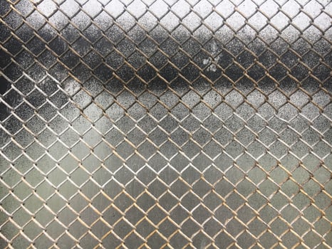 The texture of the old metal mesh of the chain. Old grid background. photo