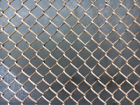 The texture of the old metal mesh of the chain. Old grid background. photo