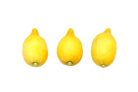 isolated lemon fruits on white background. The fruit is round and oval. The young fruit is green. When cooked it will be yellow. The fruit flesh is juicy and sour taste. photo