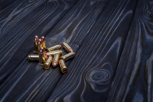 Cartridges on a wooden background photo
