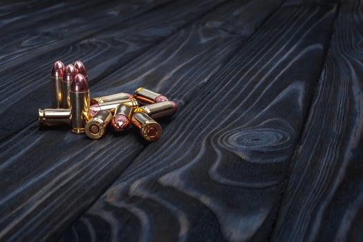 Cartridges on a wooden background photo