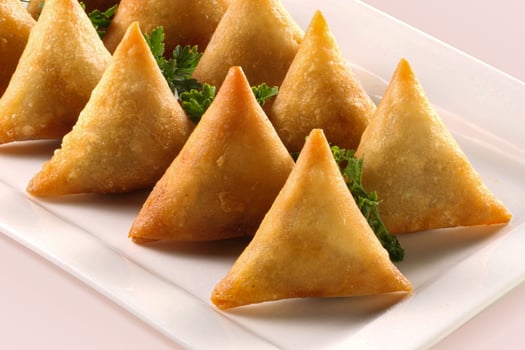Triangles Samosas white background photo
