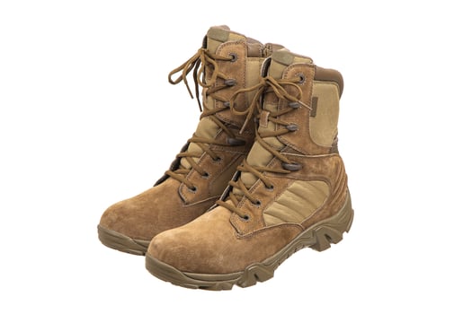 Modern army combat boots. New desert beige shoes. Isolate on a white back. photo