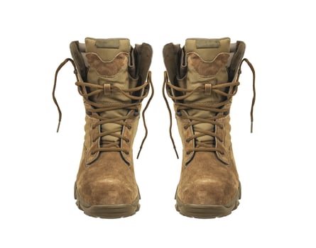 Modern army combat boots. New desert beige shoes. Isolate on a white back. photo