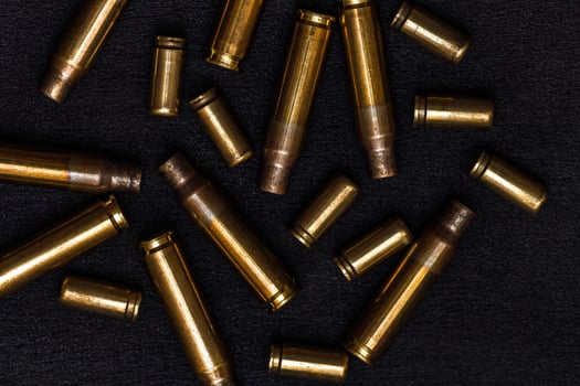 empty cartridges on a black photo