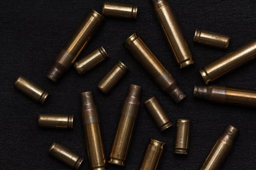 empty cartridges on a black photo