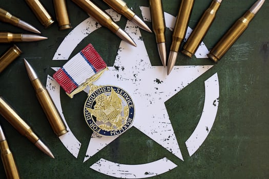 KYIV, UKRAINE - JULY 10, 2024 Distinguished Service medal. United States military award medal with ribbon and pin. Handmade paper theater props photo