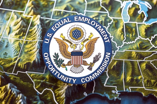 KYIV, UKRAINE - JUNE 26, 2024 U.S. Equal Employment Opportunity Commission coat of arms on paper map of United States photo