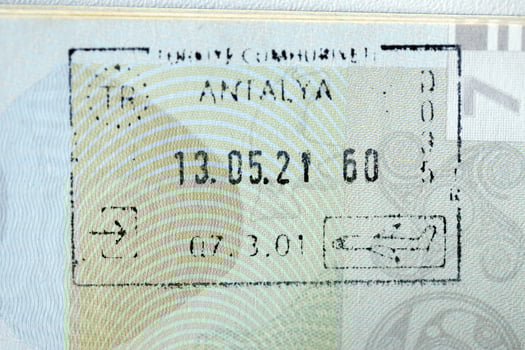 KYIV, UKRAINE - APRIL 20, 2024 Page of foreign passport with visas, Turkiye border stamps, permits to enter countries, concept of traveling around the world, travelers document photo
