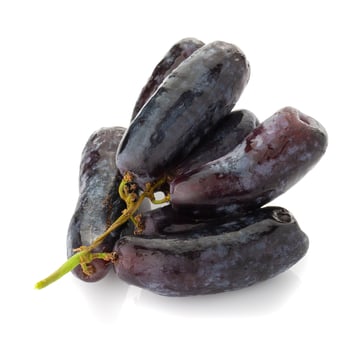 Sweet black sapphire grapes on a white background. photo