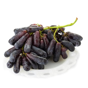 Sweet black sapphire grapes on a white background. photo
