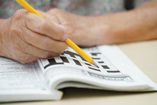 Bangkok, Thailand - May 15, 2022 elderly woman playing sudoku puzzle game. photo