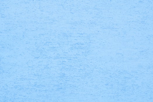 Blue plaster wall of a building. Rough surface texture. photo