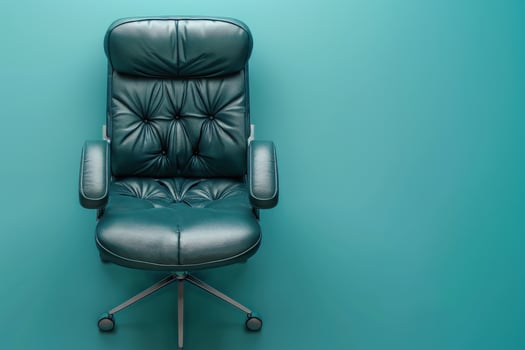A stylish leather office chair against a vibrant teal backdrop, inviting comfort and creativity in an inspiring workspace photo