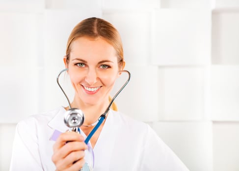 Medical doctor woman listening over white background photo