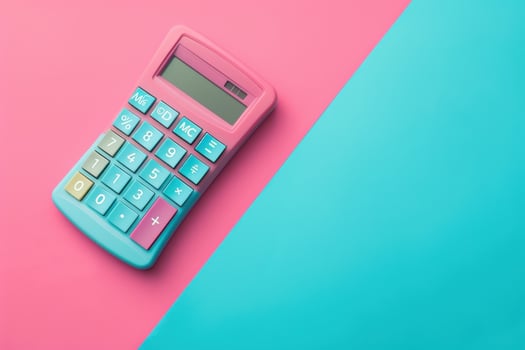 A vibrant pink and blue calculator placed on a colorful background suited for artistic workspace setups photo