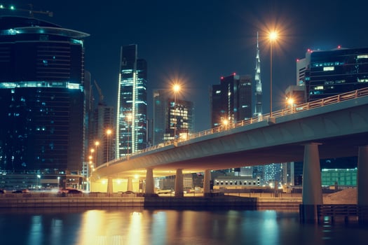 Dubai nighttime skyline with modern buildings, street lights and a bridge. Downtown Dubai, UAE. photo