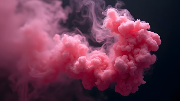 Vibrant Pink Smoke Explosion in Dark Background photo