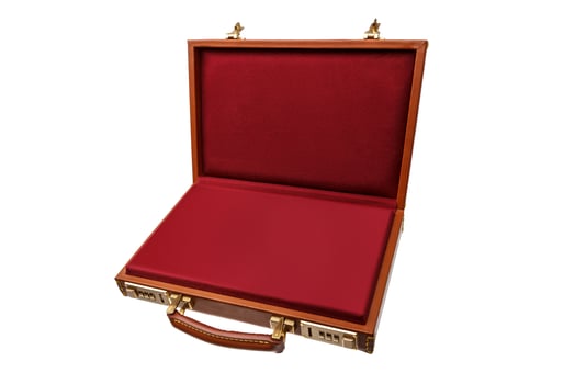 Brown leather suitcase with combination lock and gold locks isolated on white photo