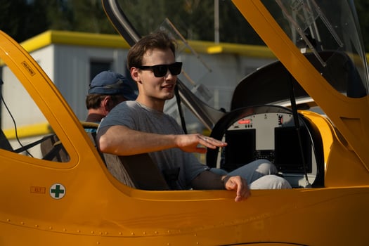 A man experiences the first sensations of flying on an airplane. First flying photo