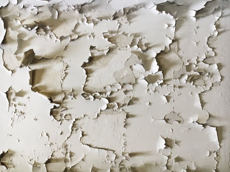 Old cracked white paint on the wall photo
