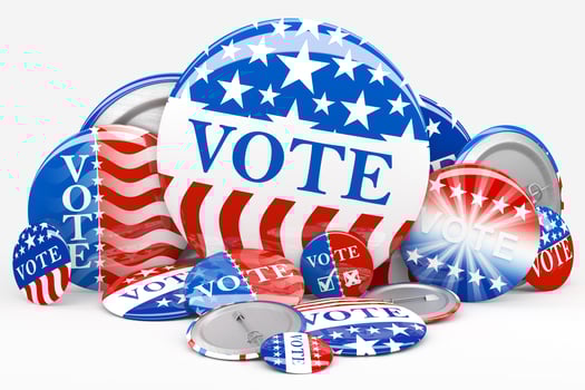 Pile of American red, white, and blue Vote pin. Collection of voting buttons for US presidential election or local elections. 3d render. photo