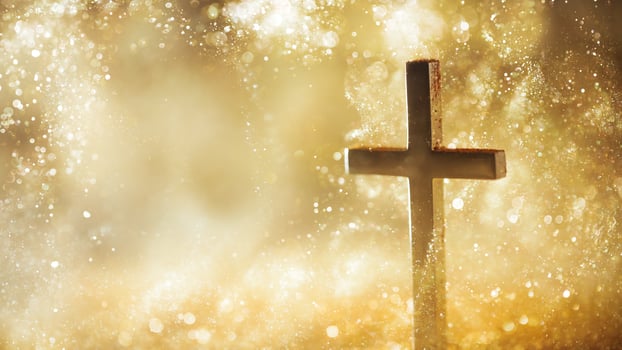 Religious cross in abstract wallpaper with shining gold sparkles and radiant lights. Symbolizing prayer, heaven, or faith. photo