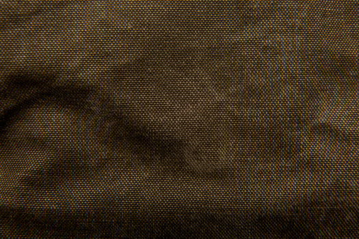 Close-up texture of a canvas fabric backpack. Leather straps and metal buckles. Vintage khaki back. photo