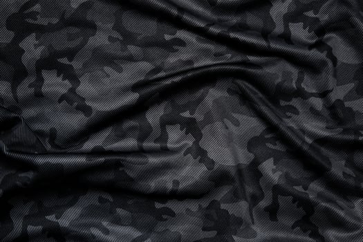 Camouflage pattern. Trendy dark gray camouflage fabric. Military texture. Dark back. photo