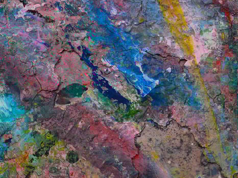 Smeared paint on table with colorful pattern for background photo