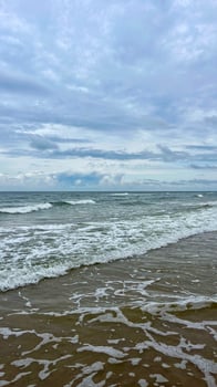 Seascape, stormy day on the Baltic Sea. Clouds meet the sea. photo