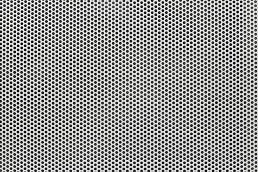 Background of wavy metallic grid with holes. Metal mesh as back. Perforated metal back. photo