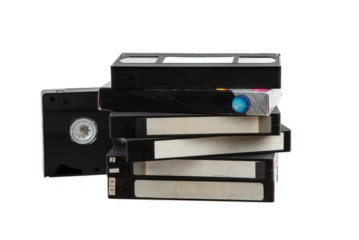 Pile of VHS cassettes. Vintage media. Isolate on a white back. photo