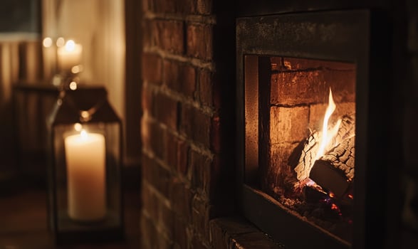 Close-up of flickering flames in a brick fireplace photo