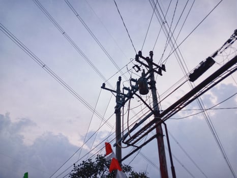 Beautiful blue cloud landscape with industrial electric forks. photo