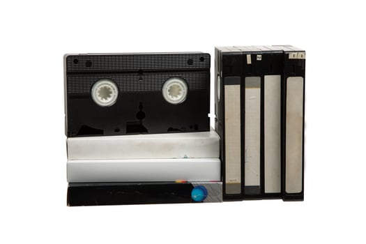 Pile of VHS cassettes. Vintage media. Isolate on a white back. photo