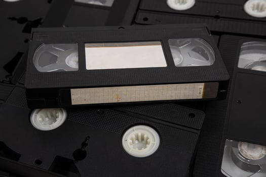 Videotape with blank tags. Pile of VHS cassettes. Vintage media. Isolate on a white back photo